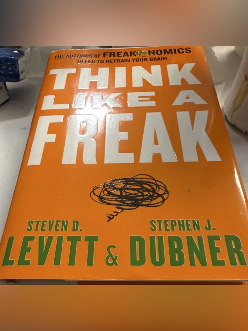 Think Like a Freak Paperback Book - Orange & White Cover